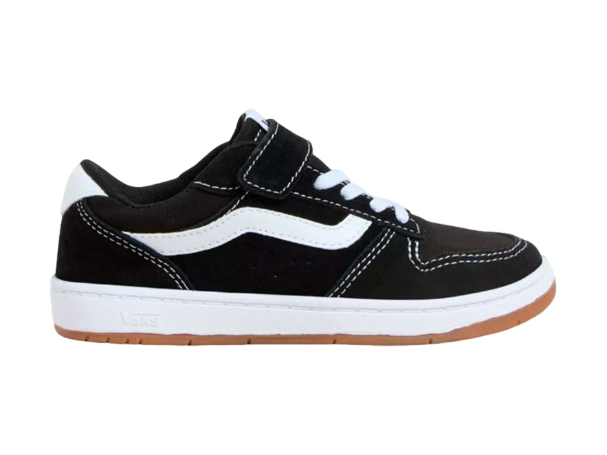 Tenis VANS Ryland LS en color negro con franja blanca, cierre de velcro y suela marrón.