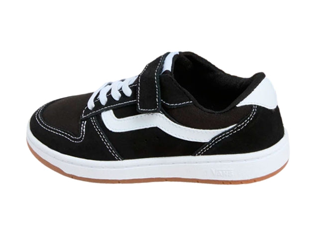 Tenis VANS Ryland LS en color negro con franja blanca, cierre de velcro y suela marrón.