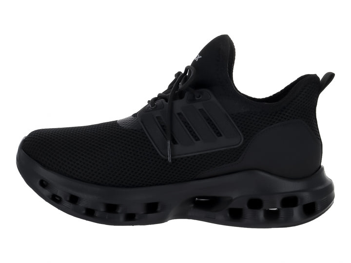 Tenis deportivos Andrax color negro con suela gruesa perforada y tejido de malla.