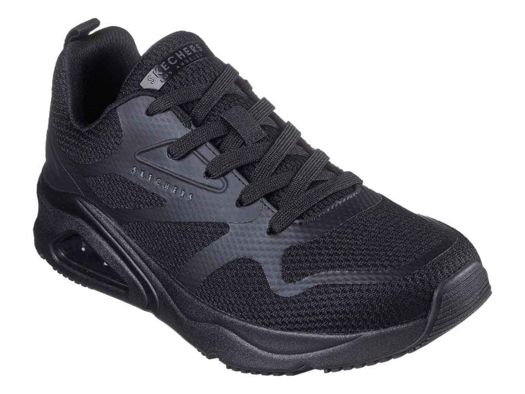 Tenis deportivos Skechers color negro con suela de amortiguación de aire visible.