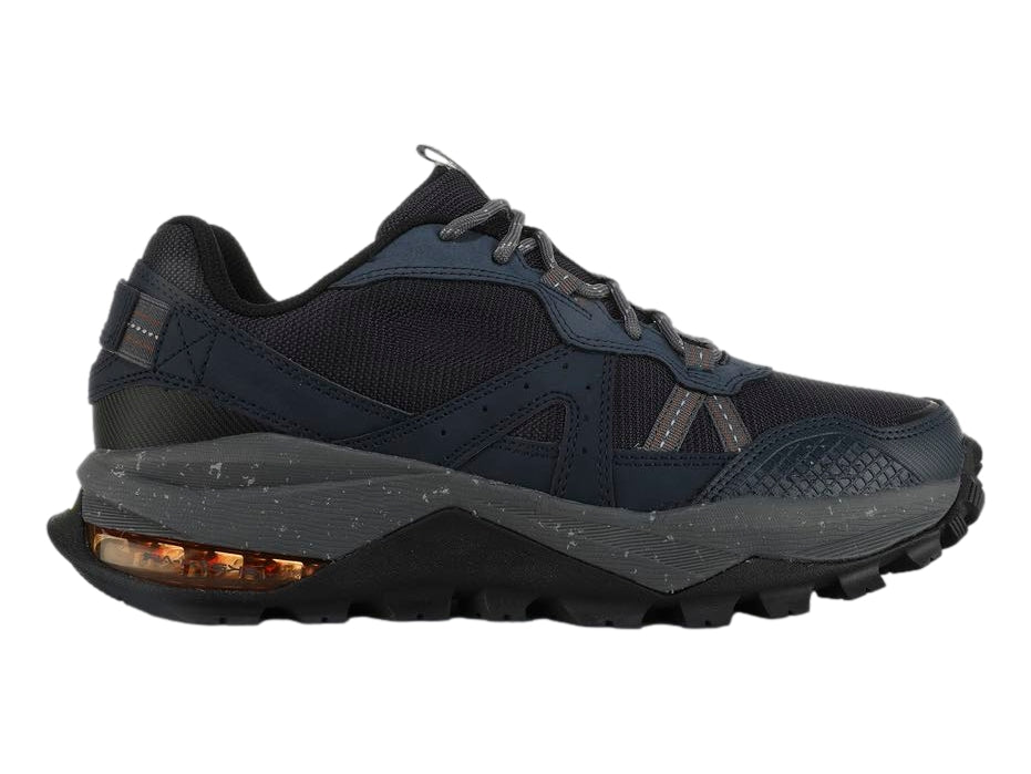 Tenis Skechers Arch Fit Trail Air en color azul marino con detalles grises y suela robusta para senderismo.