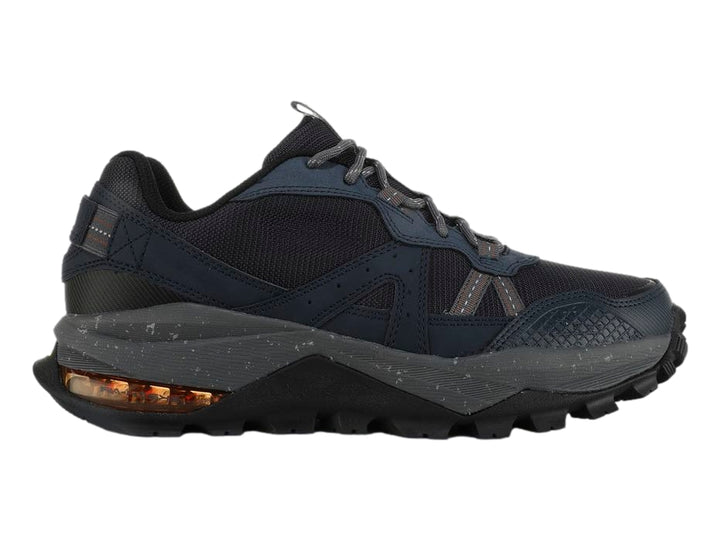 Tenis Skechers Arch Fit Trail Air en color azul marino con detalles grises y suela robusta para senderismo.
