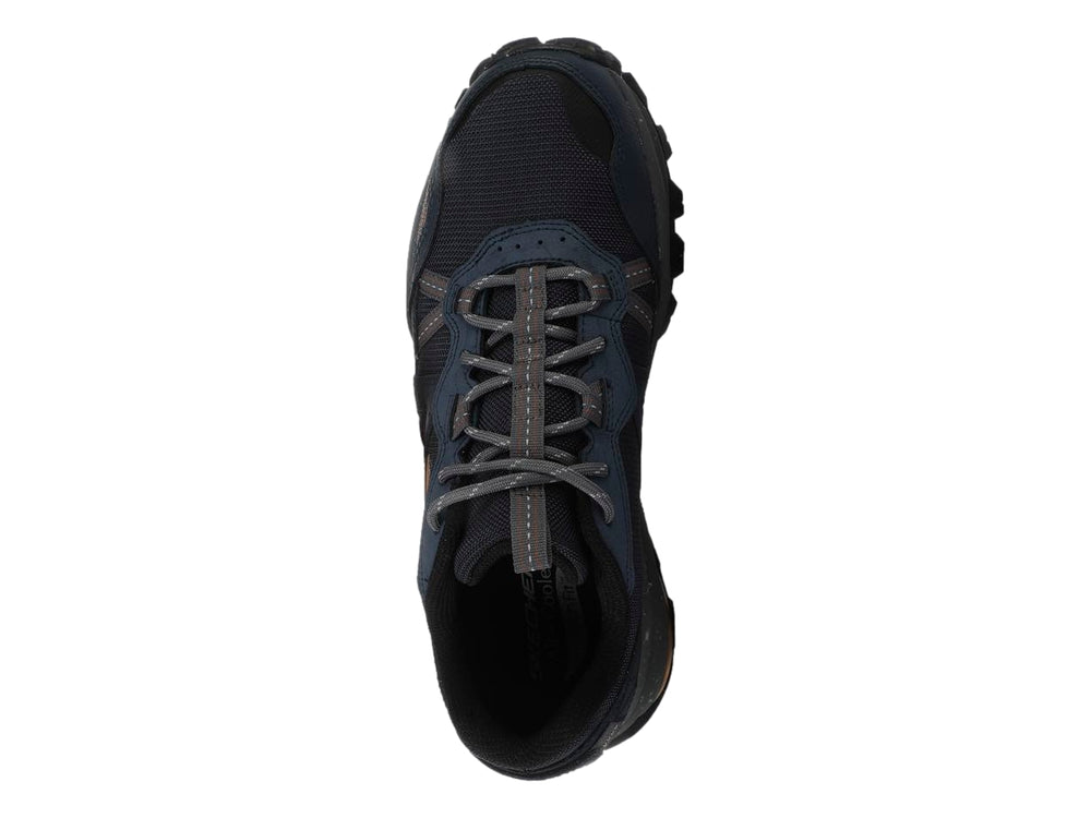 Tenis Skechers Arch Fit Trail Air en color azul marino con detalles grises y suela robusta para senderismo.