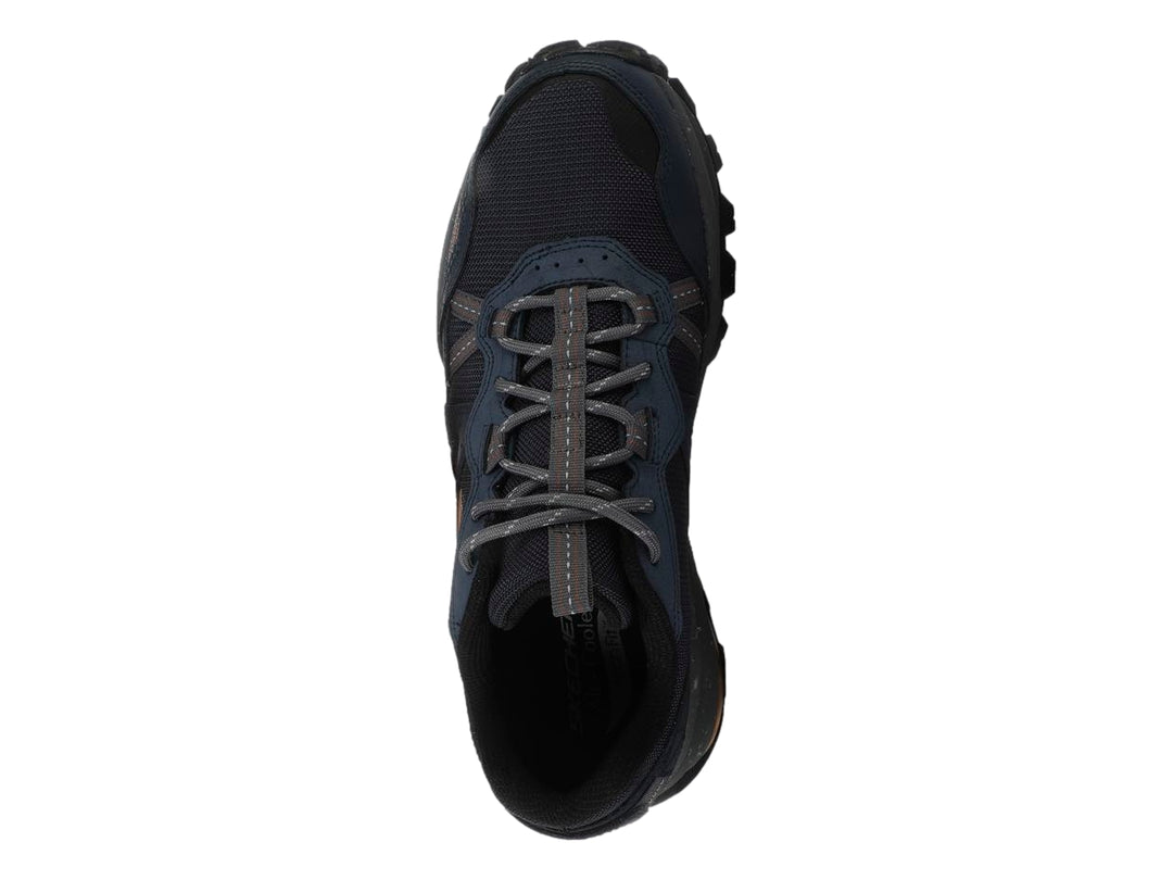 Tenis Skechers Arch Fit Trail Air en color azul marino con detalles grises y suela robusta para senderismo.