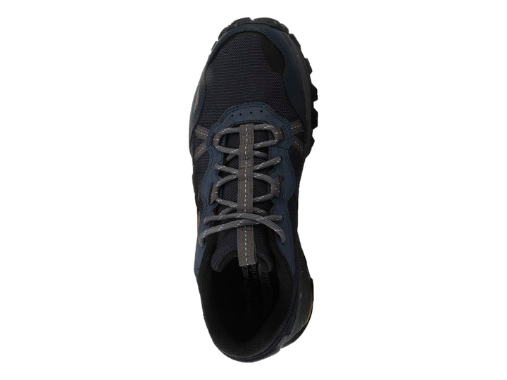 Tenis Skechers Arch Fit Trail Air en color azul marino con detalles grises y suela robusta para senderismo.