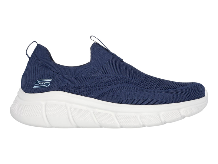 Tenis Skechers slip-on en color azul marino con suela blanca.