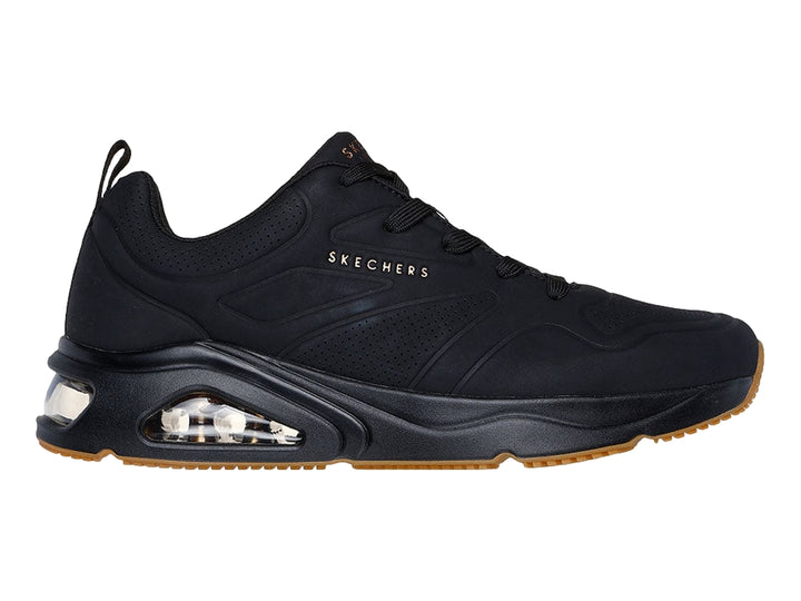 Tenis Skechers negros para hombre con cámara de aire visible en la suela y base color café.