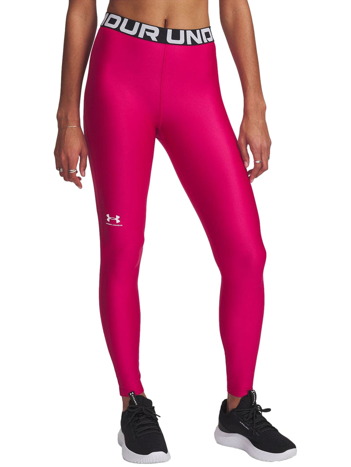 Leggings deportivos Under Armour color morado brillante con banda elástica en la cintura y logo blanco.