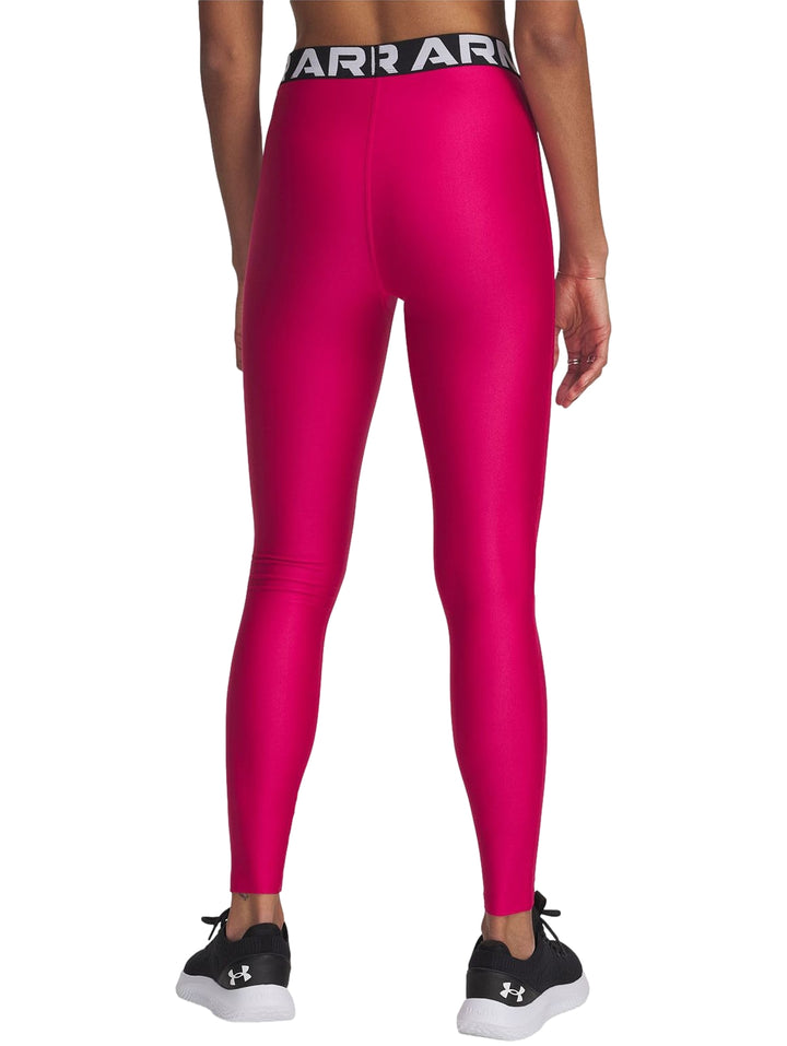 Leggings deportivos Under Armour color morado brillante con banda elástica en la cintura y logo blanco.