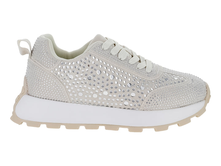 Tenis color beige con cristales brillantes y suela blanca.