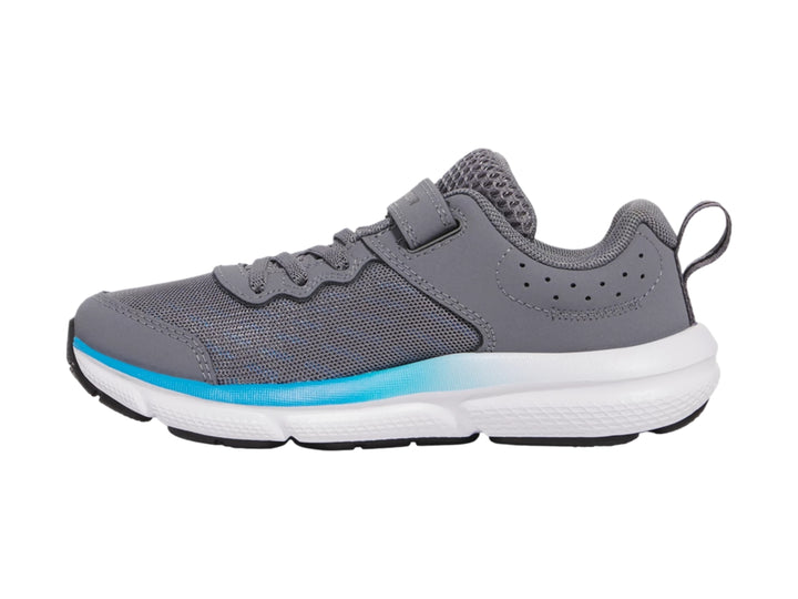 Tenis deportivos Under Armour color gris con suela blanca y detalle azul, cierre de velcro.