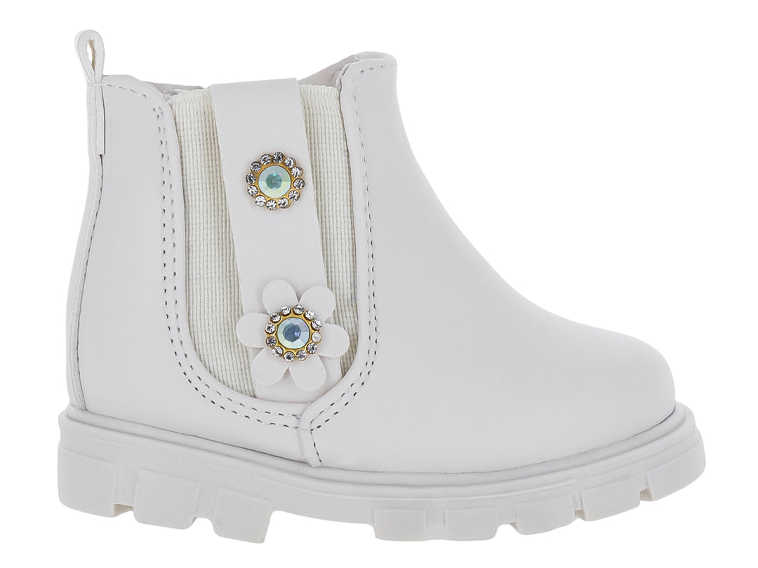 Bota color latte para niña con suela track y adornos de flor y pedrería.