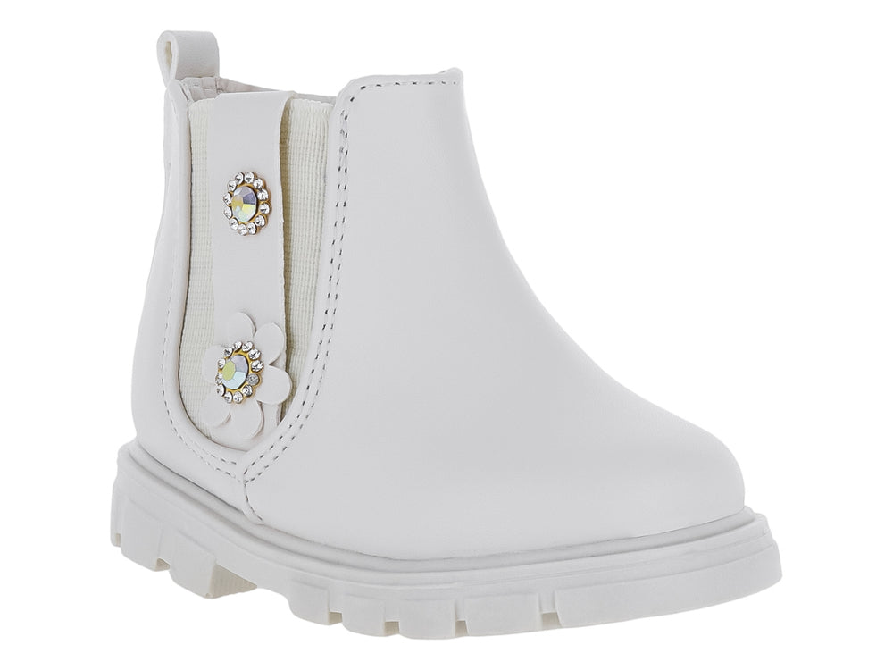 Bota color latte para niña con suela track y adornos de flor y pedrería.