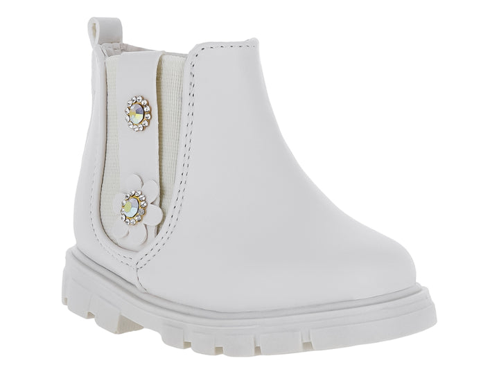 Bota color latte para niña con suela track y adornos de flor y pedrería.