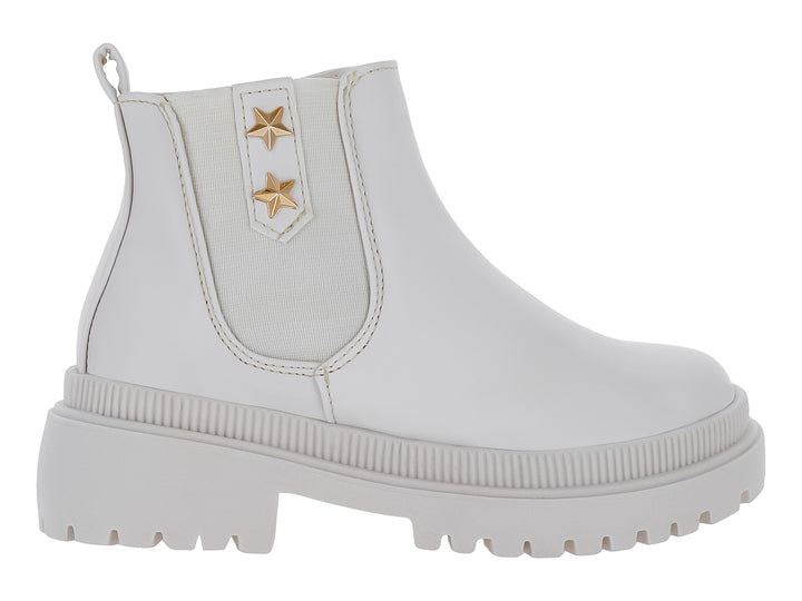 Bota de tobillo color latte con suela track y dos estrellas doradas en el lateral.