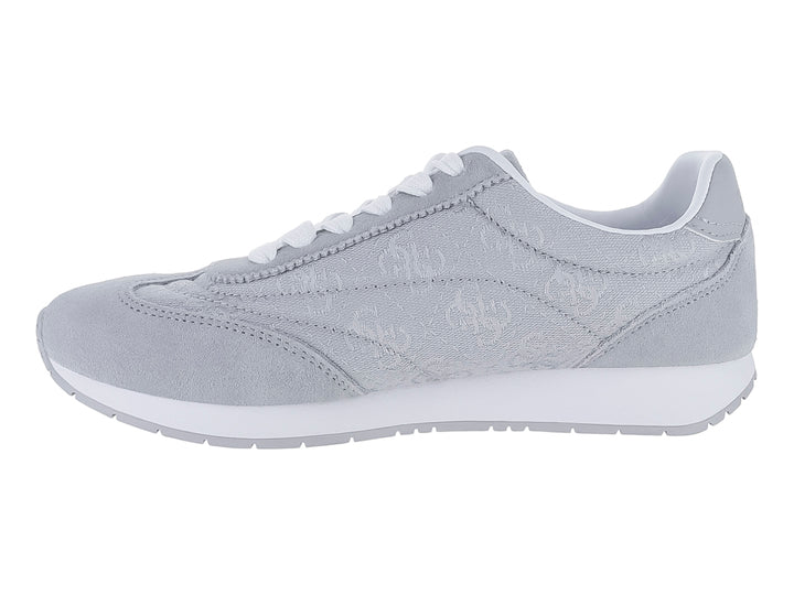 Tenis deportivos Guess color gris con suela y cordones blancos.