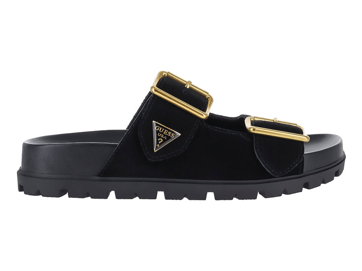 Sandalia negra GUESS con plataforma, suela dentada y dos hebillas decorativas en color dorado.