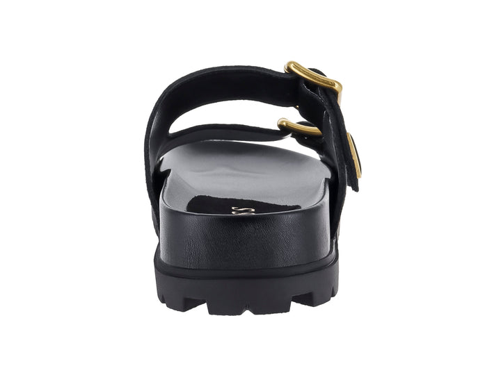 Sandalia negra GUESS con plataforma, suela dentada y dos hebillas decorativas en color dorado.