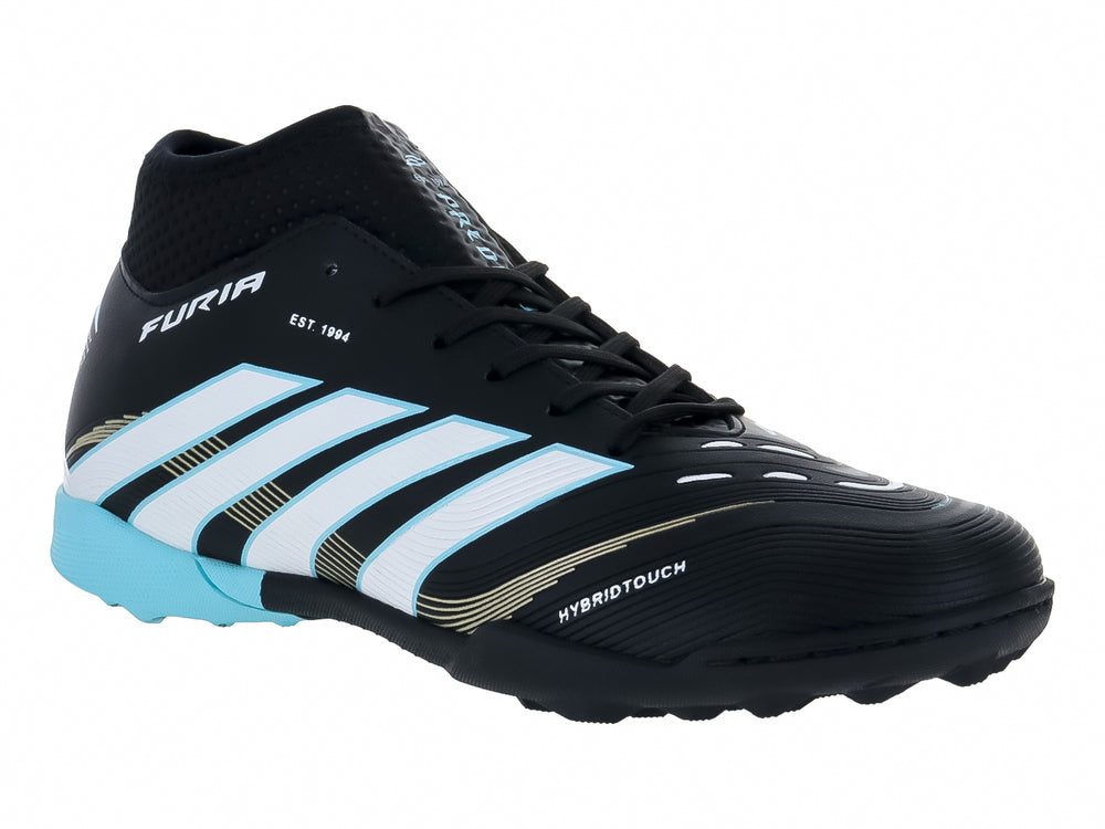 Calzado de fútbol FURIA color negro con detalles en blanco y menta, diseño sintético para superficies artificiales.