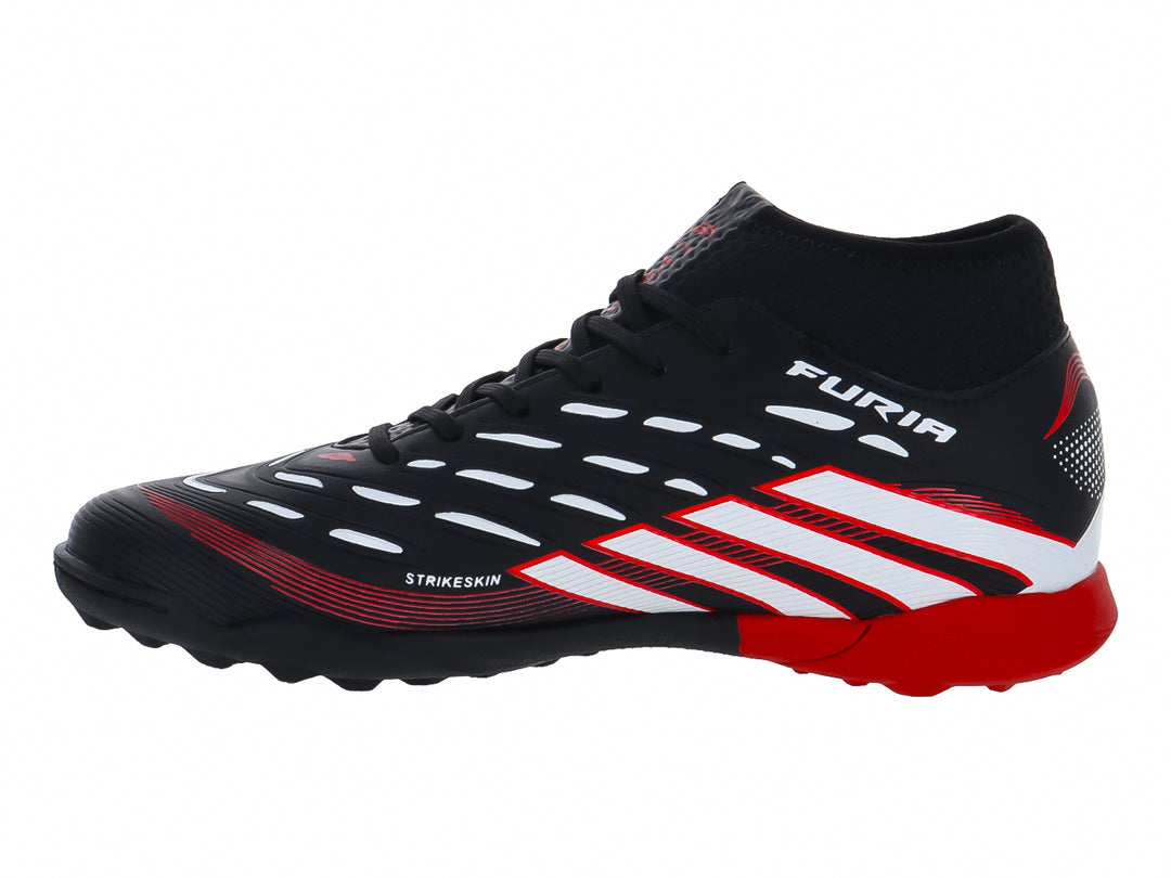 Zapato de fútbol Furia color negro con rayas blancas y suela roja para terreno sintético.