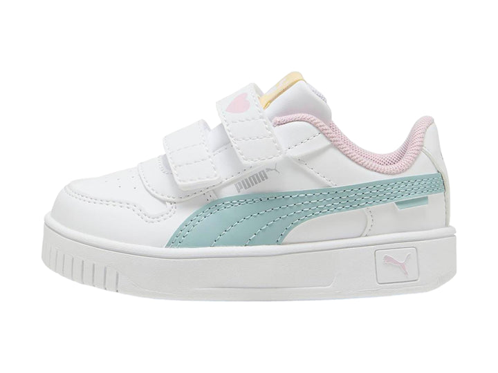 Tenis Puma blancos para niña con franja color menta, detalles en rosa y cierre de velcro.