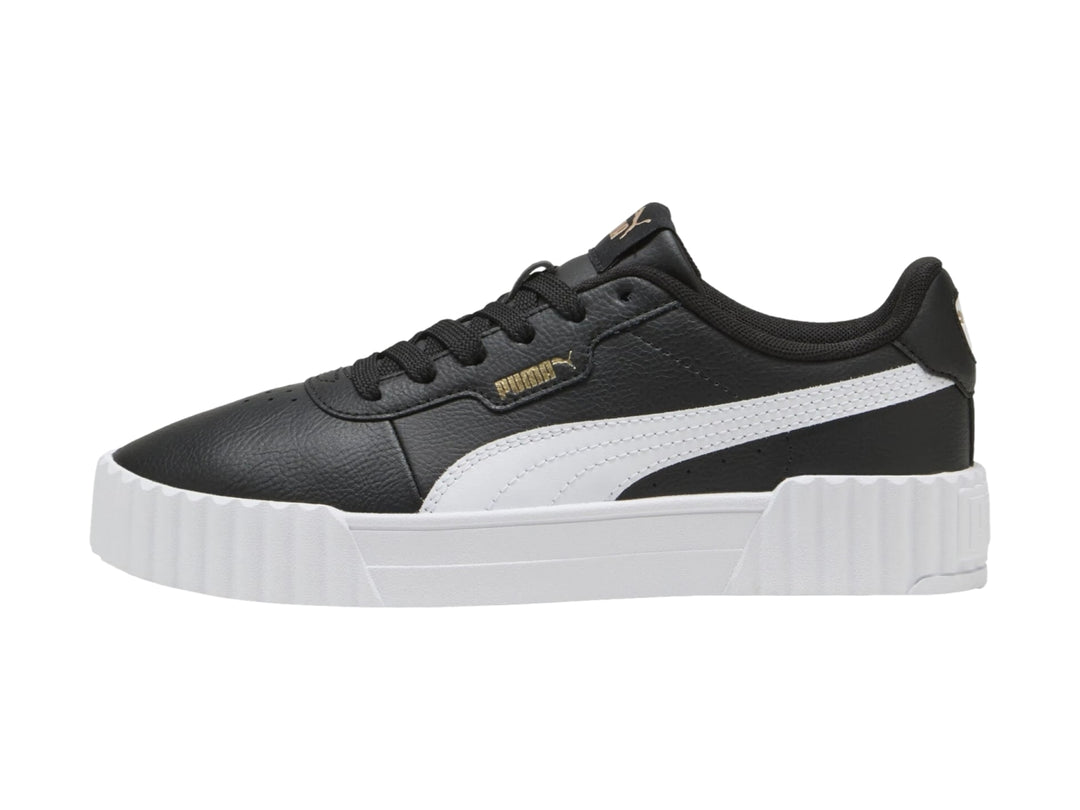 Tenis PUMA Carina 3.0 en color negro con franja blanca lateral y suela de plataforma blanca.