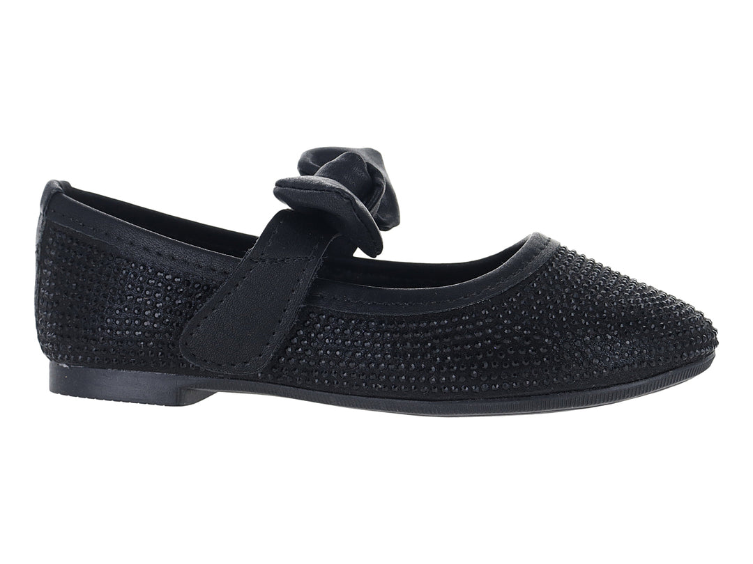 Zapato plano color negro con moño decorativo y acabado texturizado.