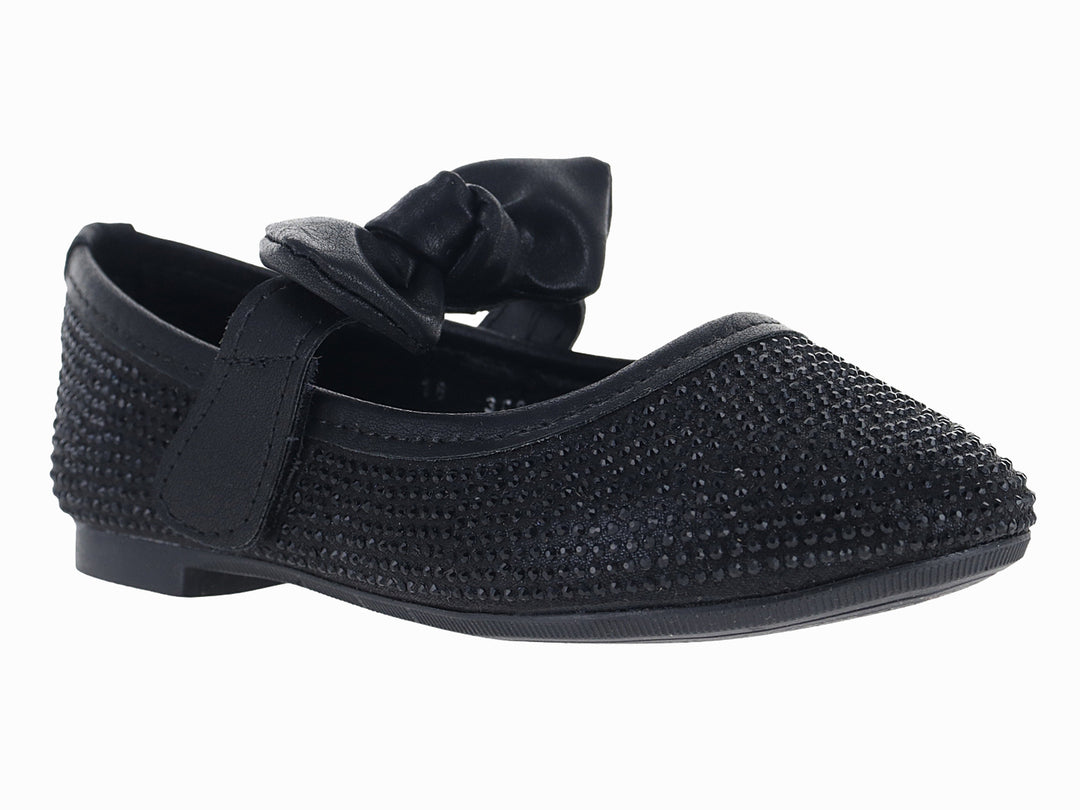 Zapato plano color negro con moño decorativo y acabado texturizado.