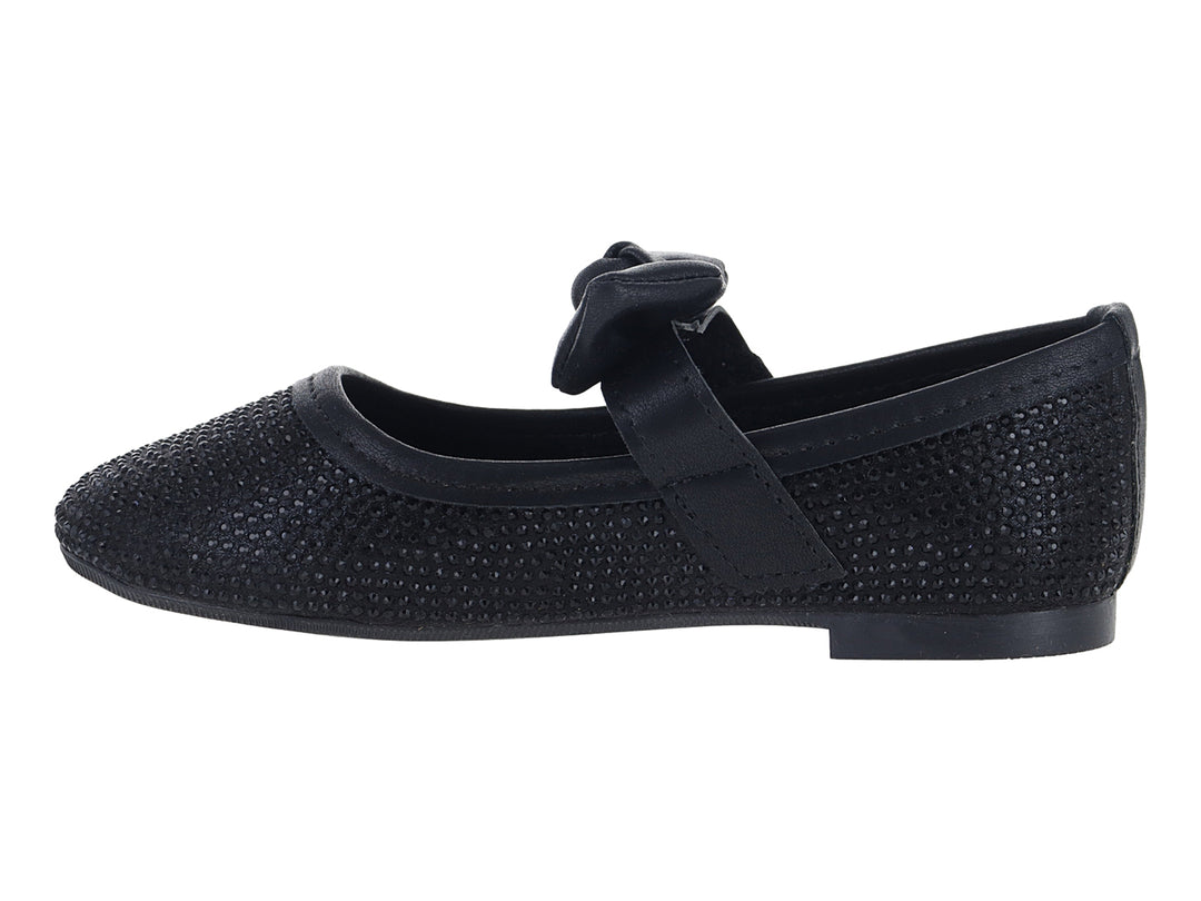 Zapato plano color negro con moño decorativo y acabado texturizado.