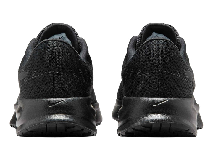 Tenis deportivos Nike Run Defy en color negro con suela gruesa y malla transpirable.