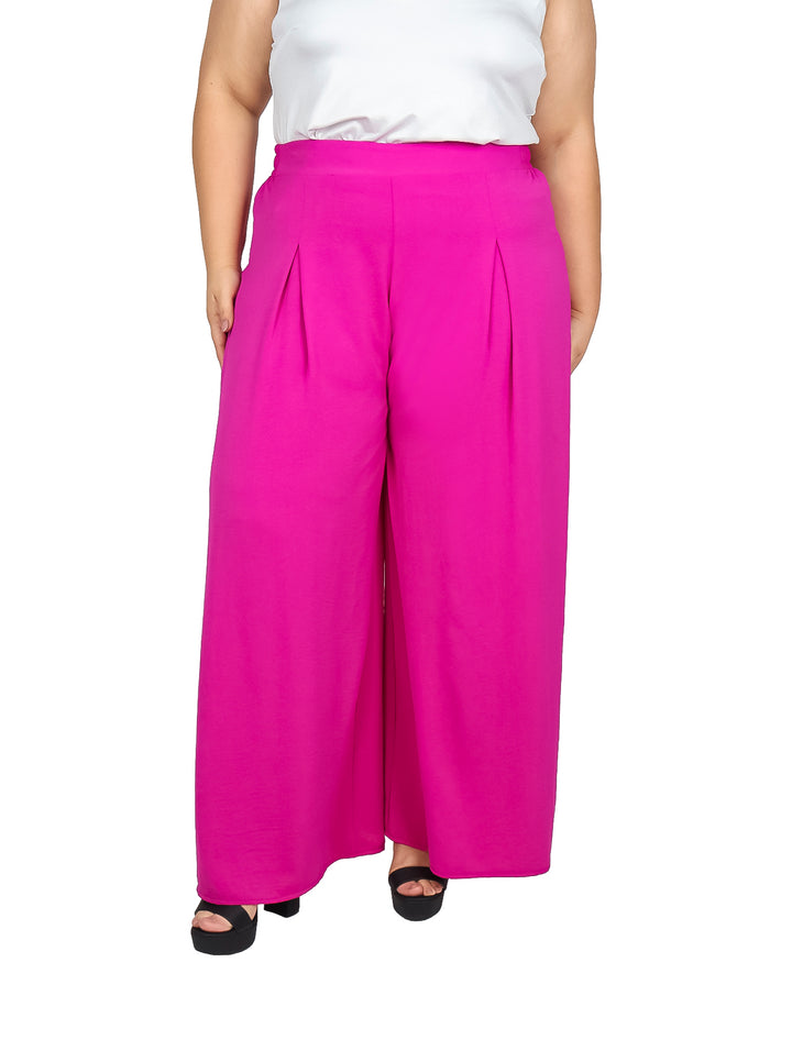 Pantalón ancho color rosa fuerte con pinzas frontales y corte palazzo.