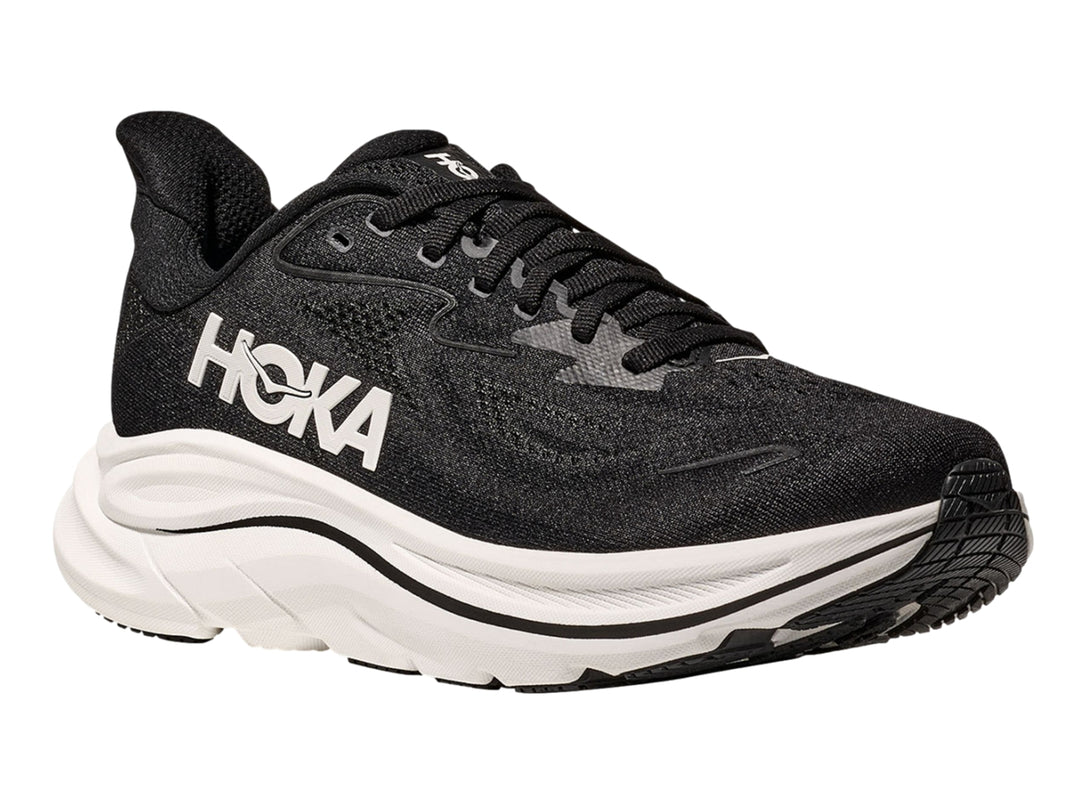 Tenis deportivos HOKA color negro con suela blanca ancha y logotipo blanco lateral.