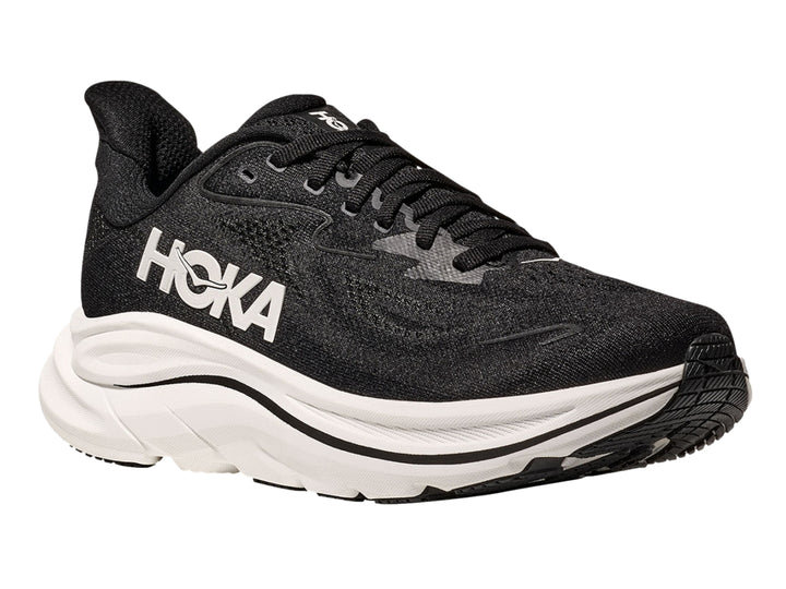 Tenis deportivos HOKA color negro con suela blanca ancha y logotipo blanco lateral.