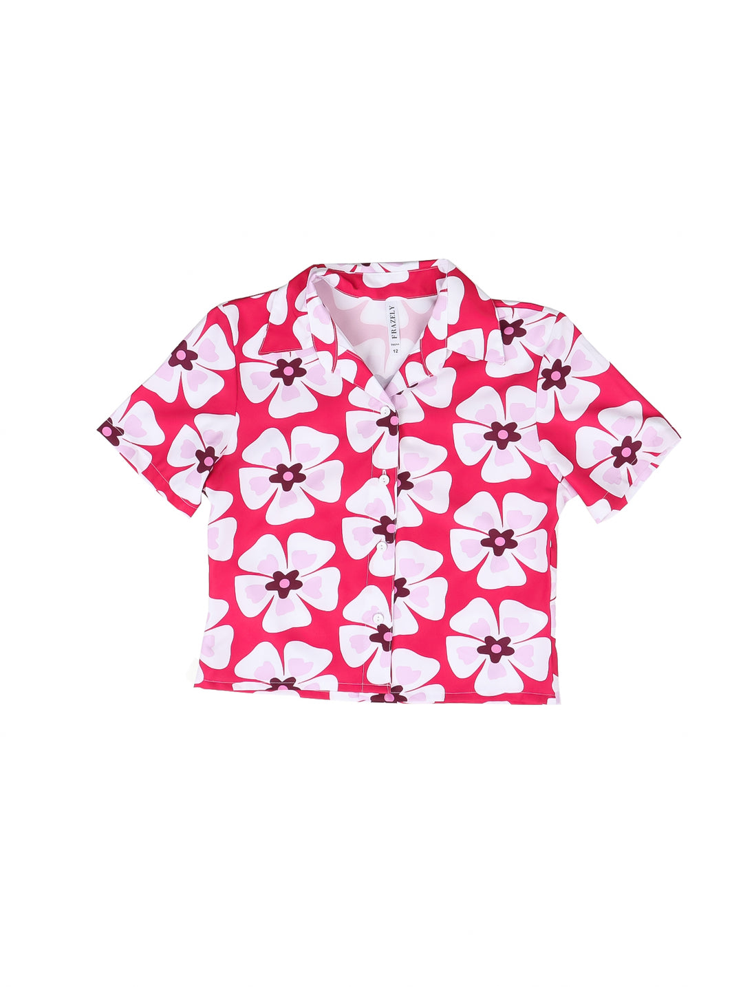 Camisera fucsia para niña con estampado de flores blancas grandes y cuello clásico.