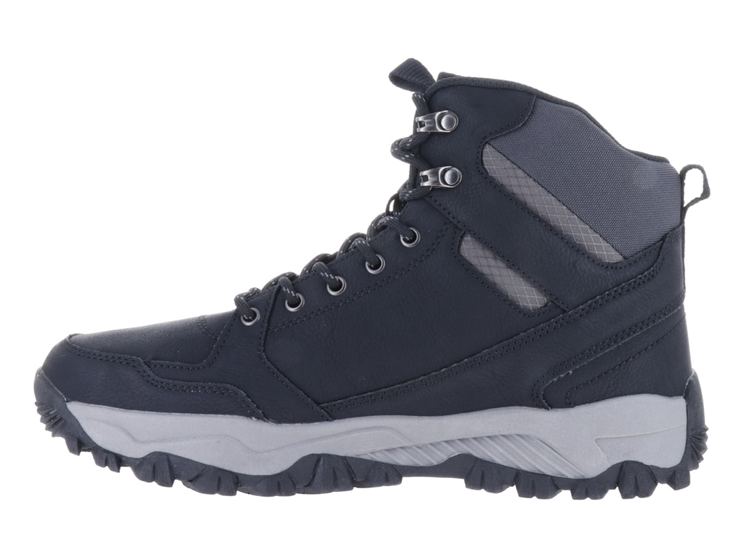 Botín deportivo Murren color negro con suela gris y diseño robusto para actividades al aire libre.