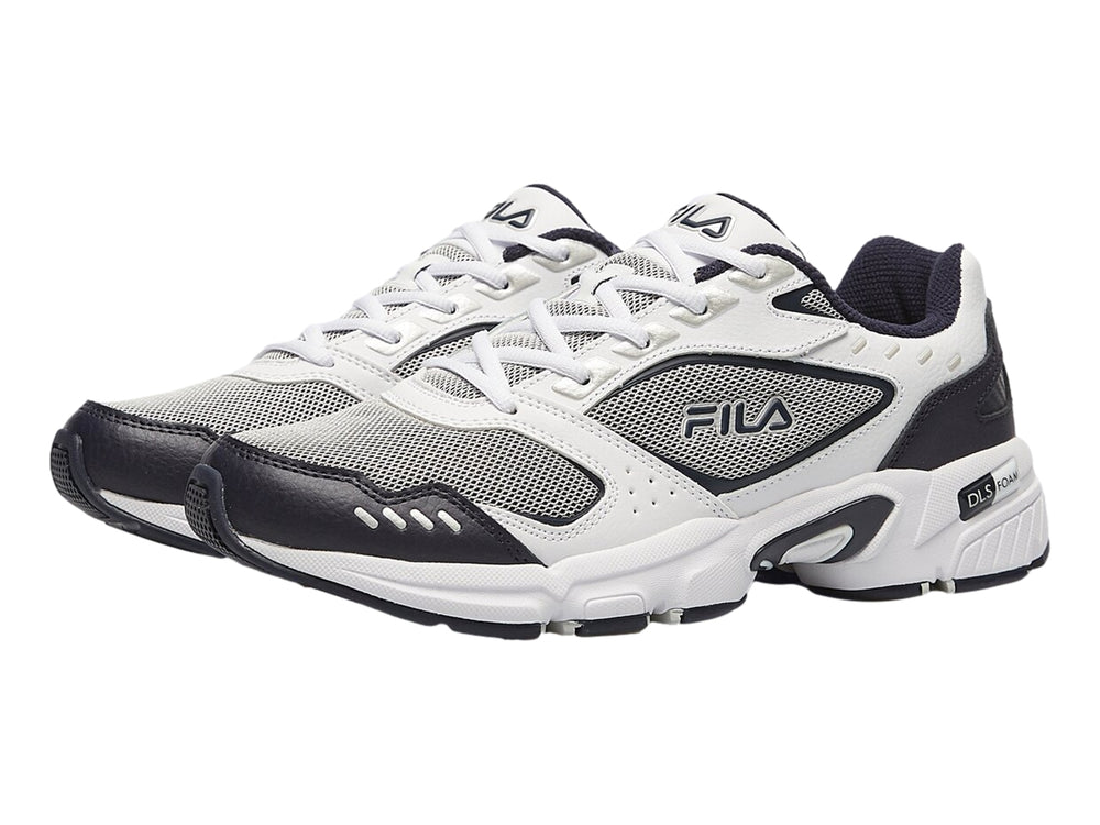 Tenis deportivos Fila en colores blanco, azul marino y gris con suela blanca robusta.