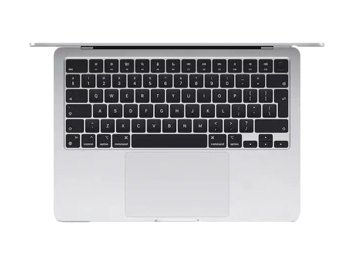 Laptop Apple MacBook Air color plata con pantalla encendida mostrando fondo abstracto en tonos azules y verdes.