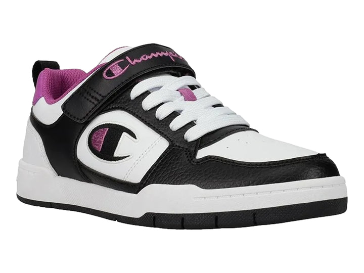 Tenis deportivos Champion en colores blanco y negro con detalles en morado y correa ajustable.