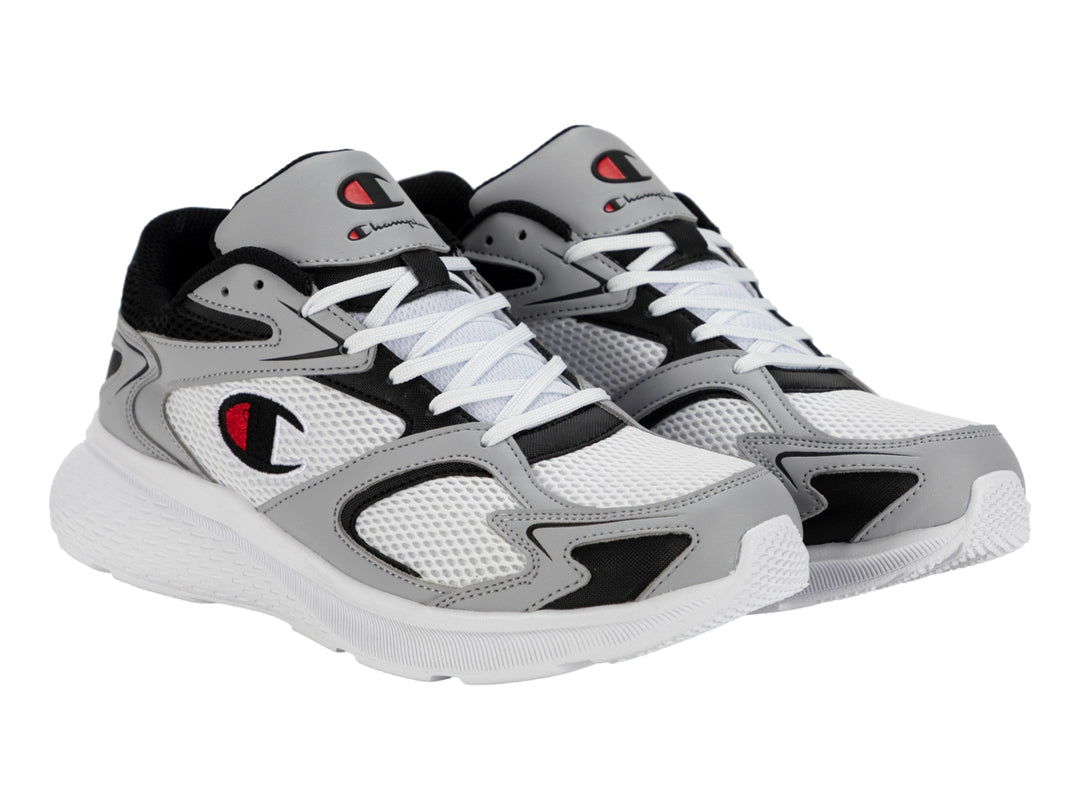 Tenis deportivos Champion modelo Brisk Retro Run en colores blanco, gris y negro con detalles en rojo.