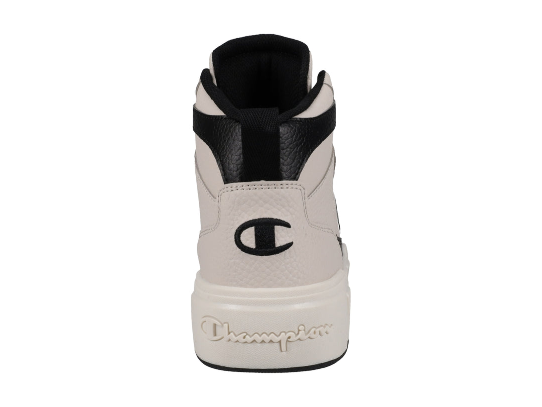 Tenis Champion de bota color beige con detalles y cordones en color negro.
