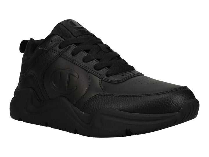 Tenis Champion color negro con suela gruesa y logotipo grabado en el lateral.