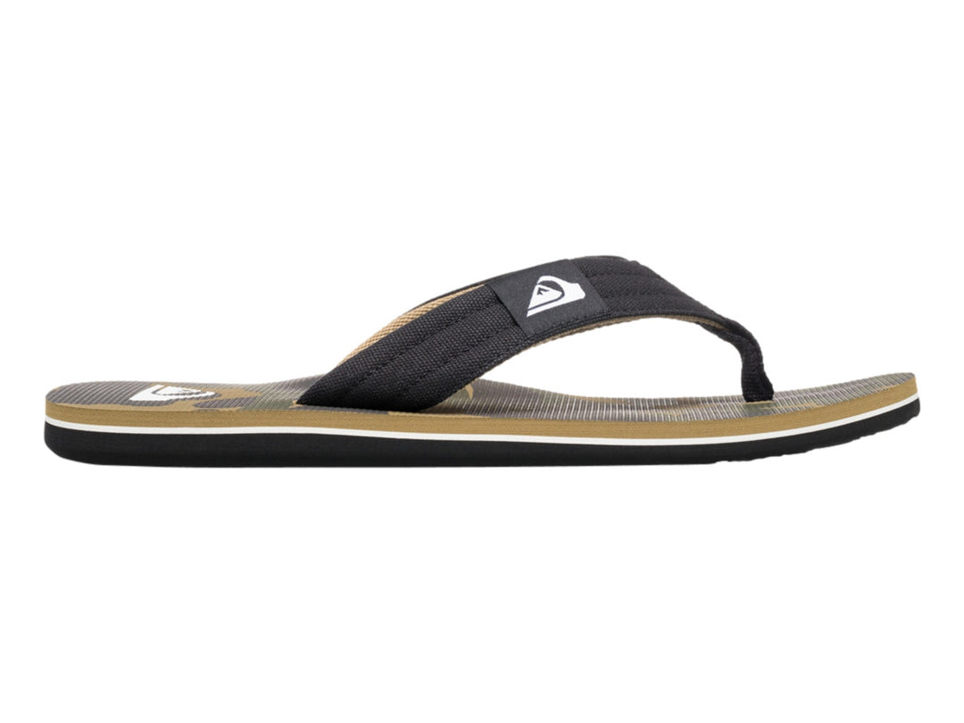 Sandalia de dedo Quiksilver en colores negro y beige con suela blanca y negra.