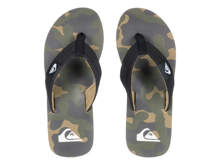 Sandalia de dedo Quiksilver en colores negro y beige con suela blanca y negra.