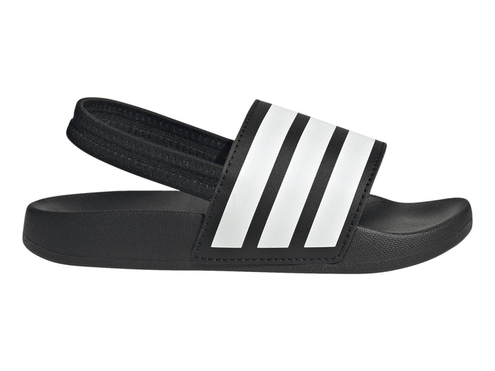 Sandalias Adidas Adilette negras para niños con tres franjas blancas en la correa.