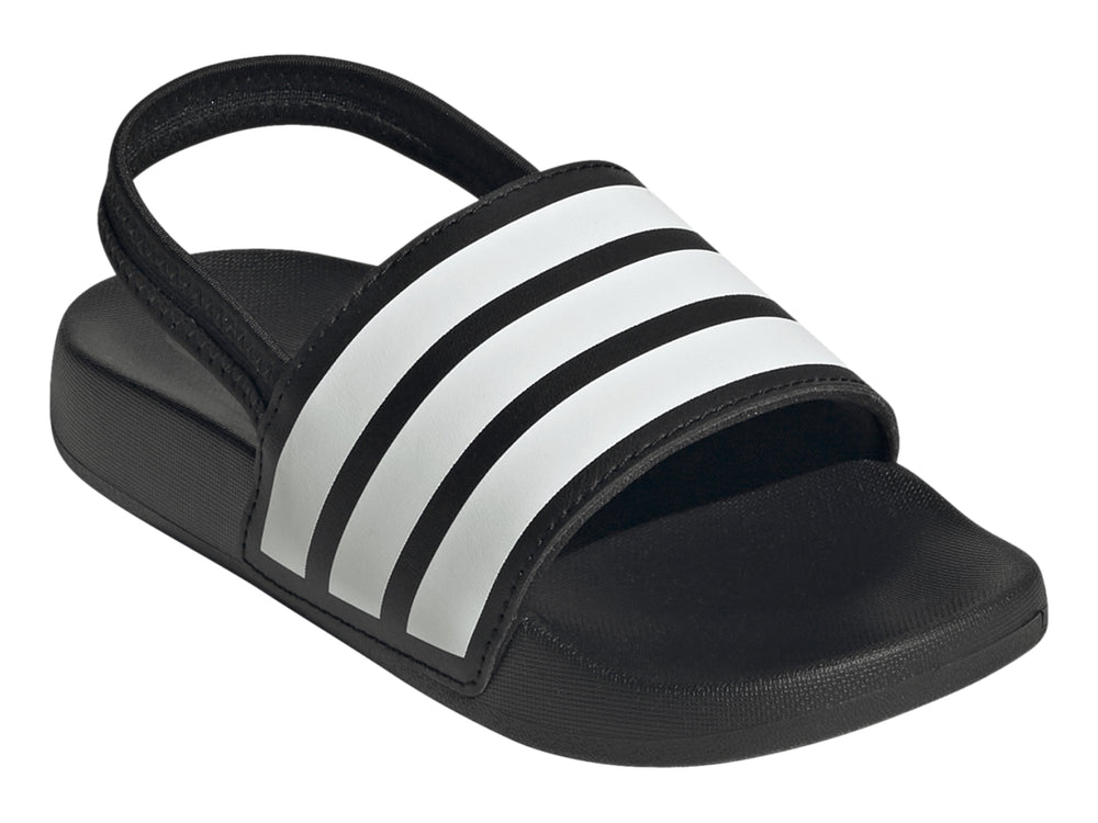 Sandalias Adidas Adilette negras para niños con tres franjas blancas en la correa.