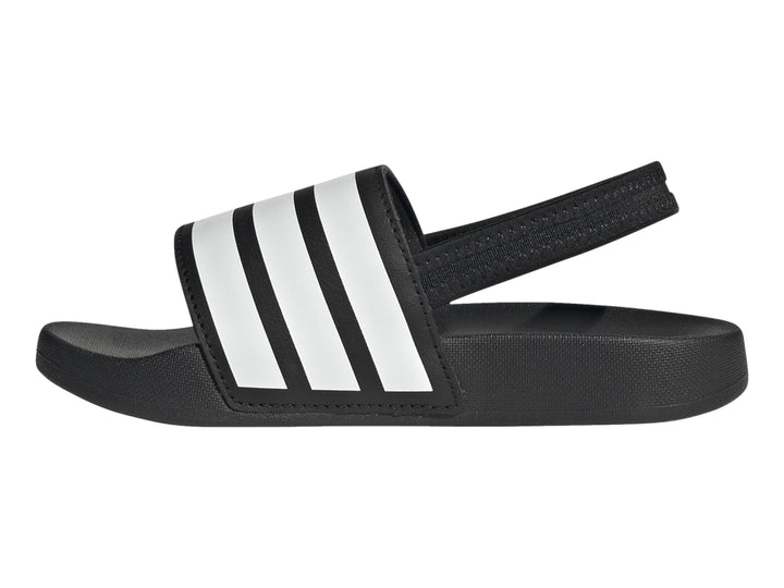 Sandalias Adidas Adilette negras para niños con tres franjas blancas en la correa.