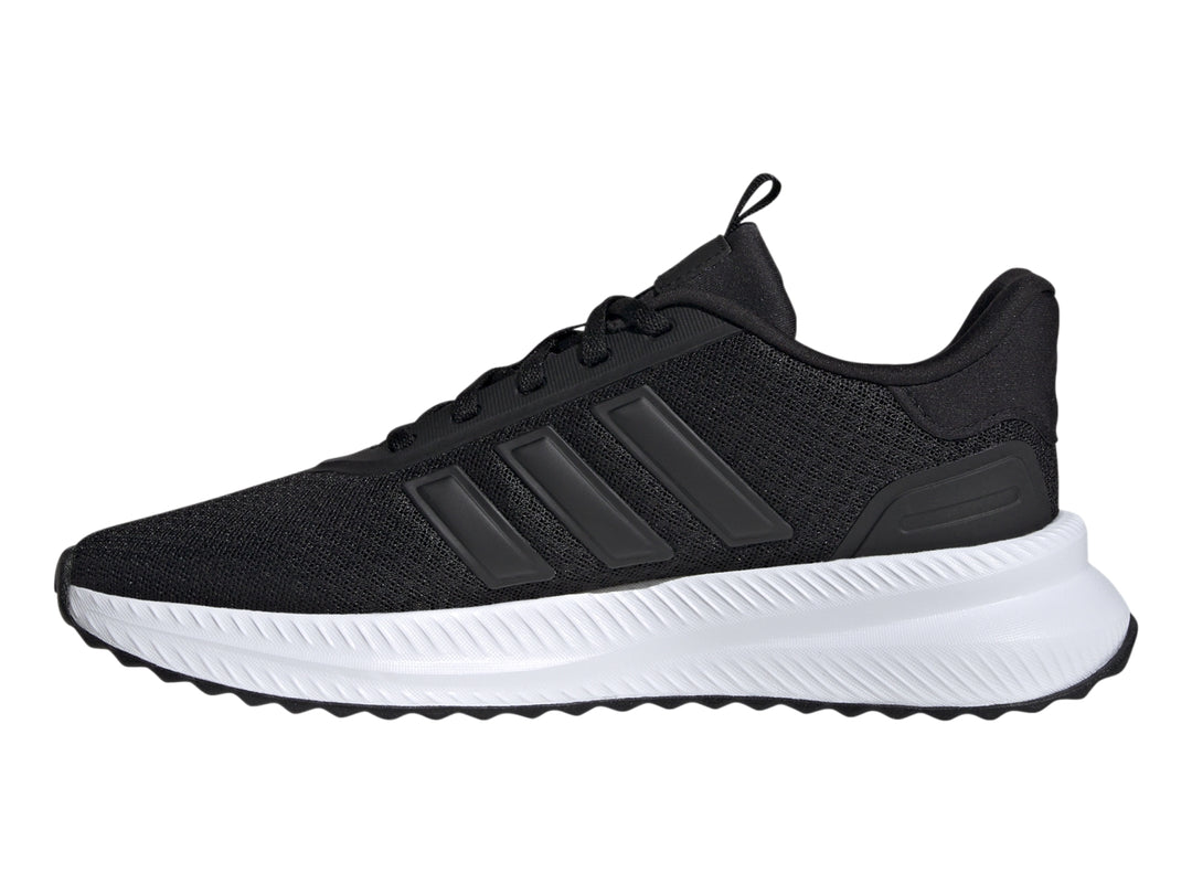 Tenis deportivos Adidas color negro con suela blanca y detalles en malla.