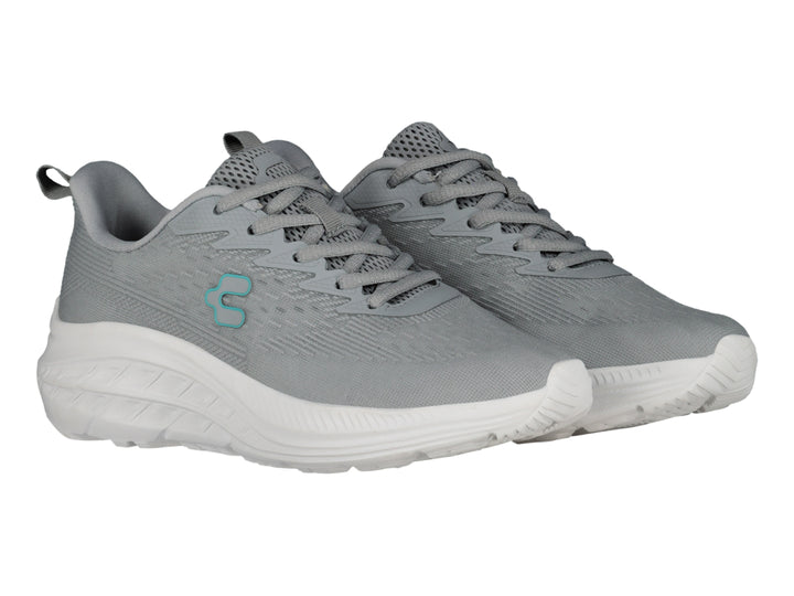 Tenis deportivos Charly color gris con suela blanca y logotipo en azul claro.