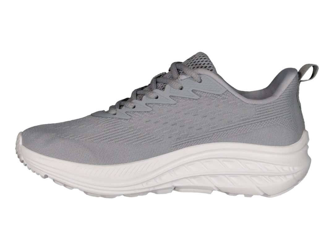 Tenis deportivos Charly color gris con suela blanca y logotipo en azul claro.