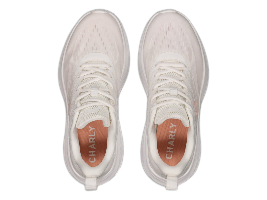 Tenis deportivos Charly color blanco con suela amortiguada y tejido transpirable.